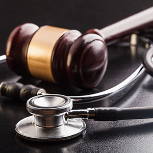 A gavel and stethoscope side-by-side, symbolizing the intersection of law and medicine.